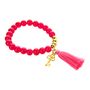Pulsera Rosa Con Borla Y Llave